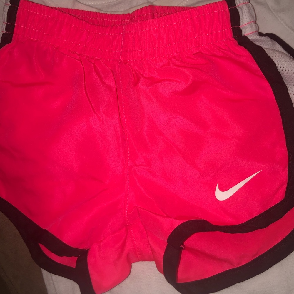 NWOT; Nike. 12 month girl. Bright pink shorts